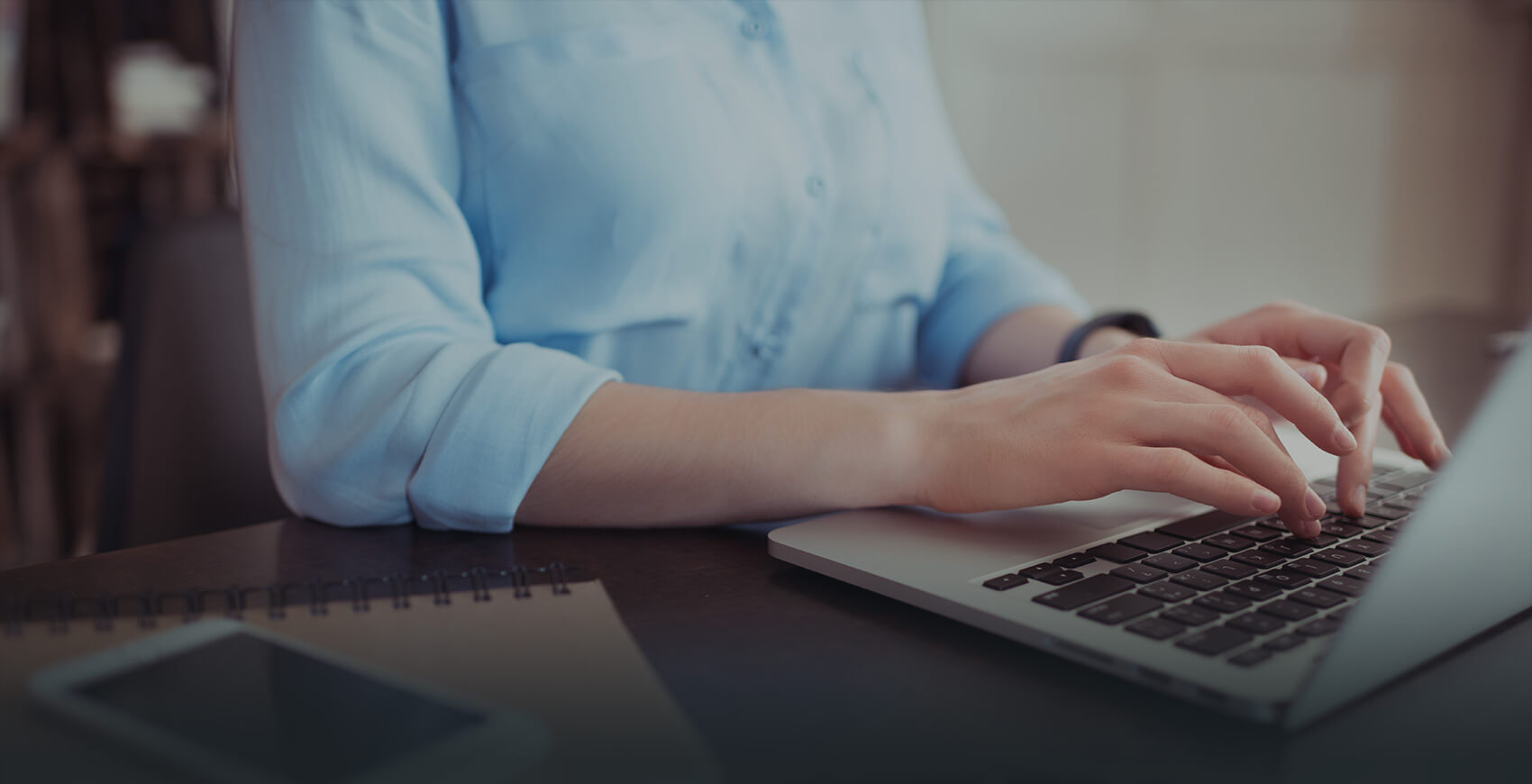 a person typing on a laptop